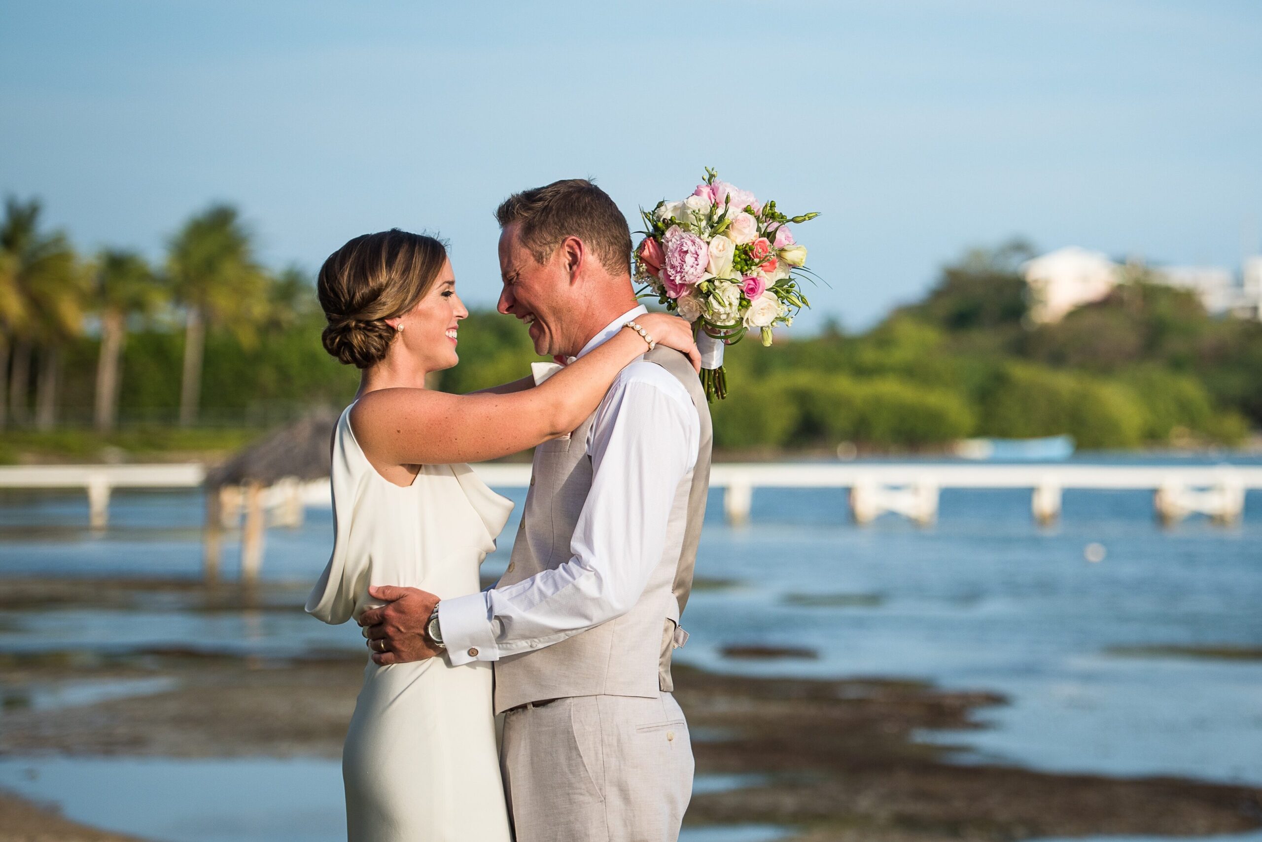 Two people in a relationship looking at each other lovingly on their wedding day