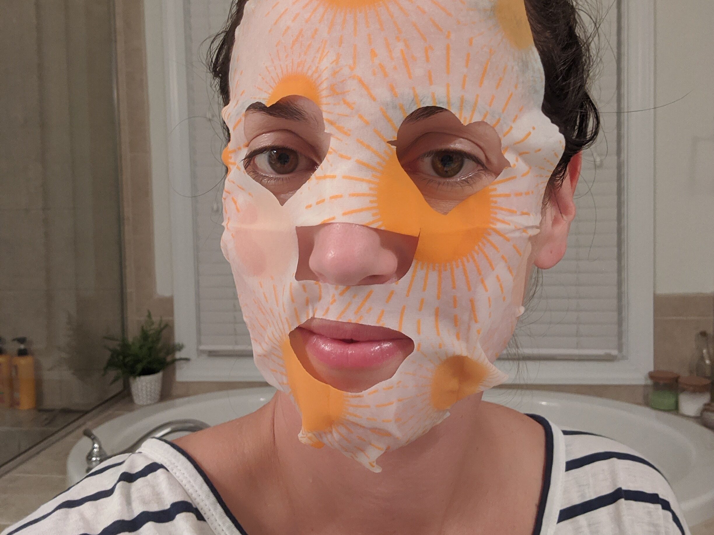 Women wearing a facial sheet mask 