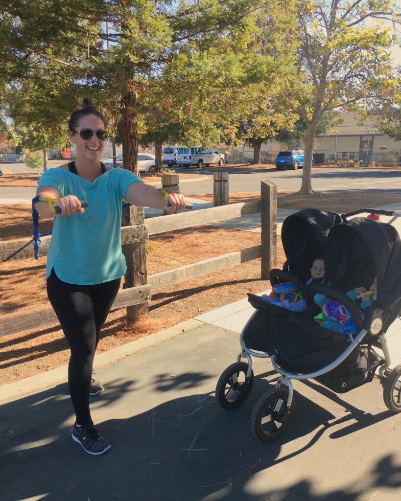 Mom working out with her toddlers 