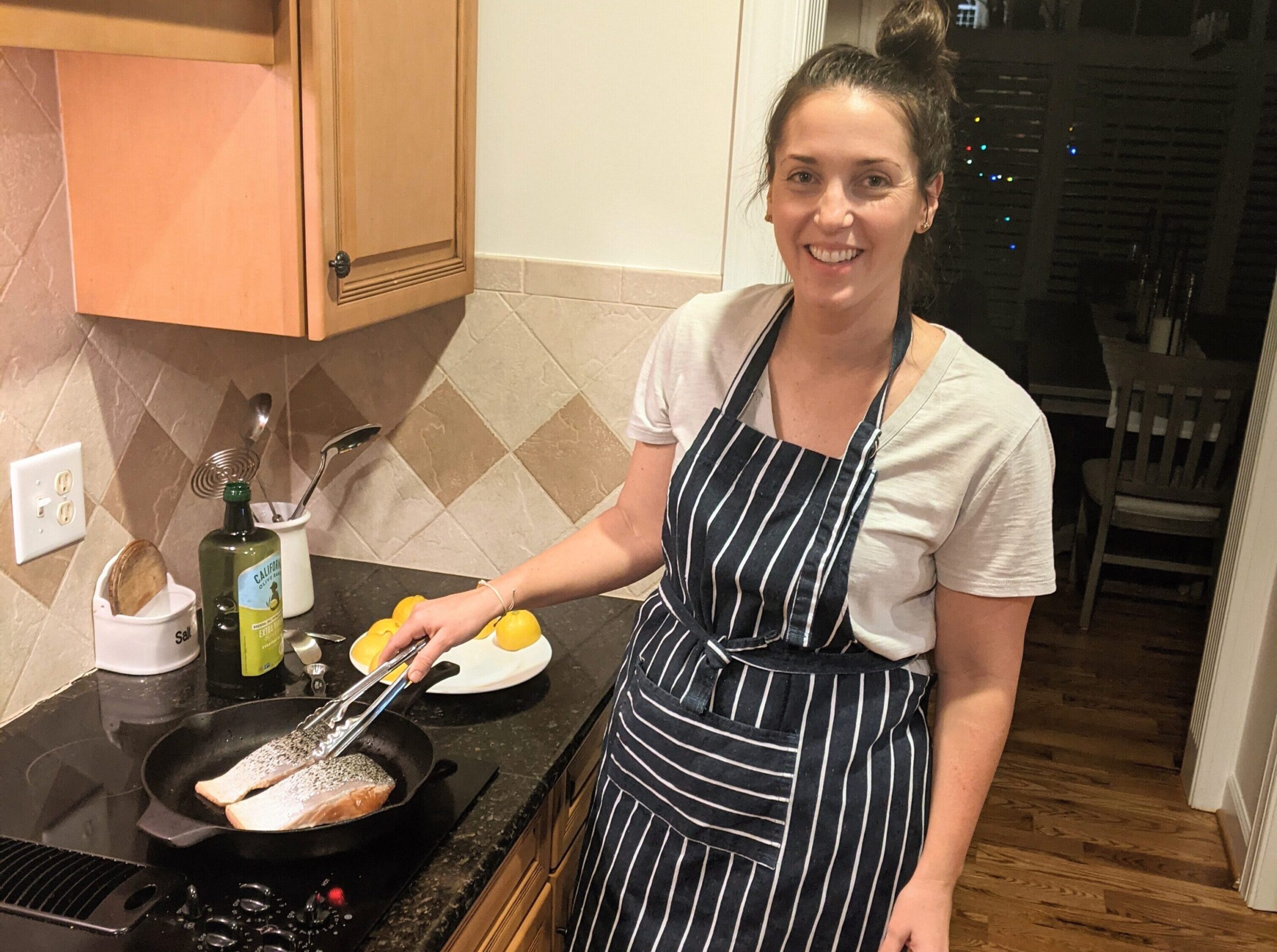 Woman cooking dinner on the stove